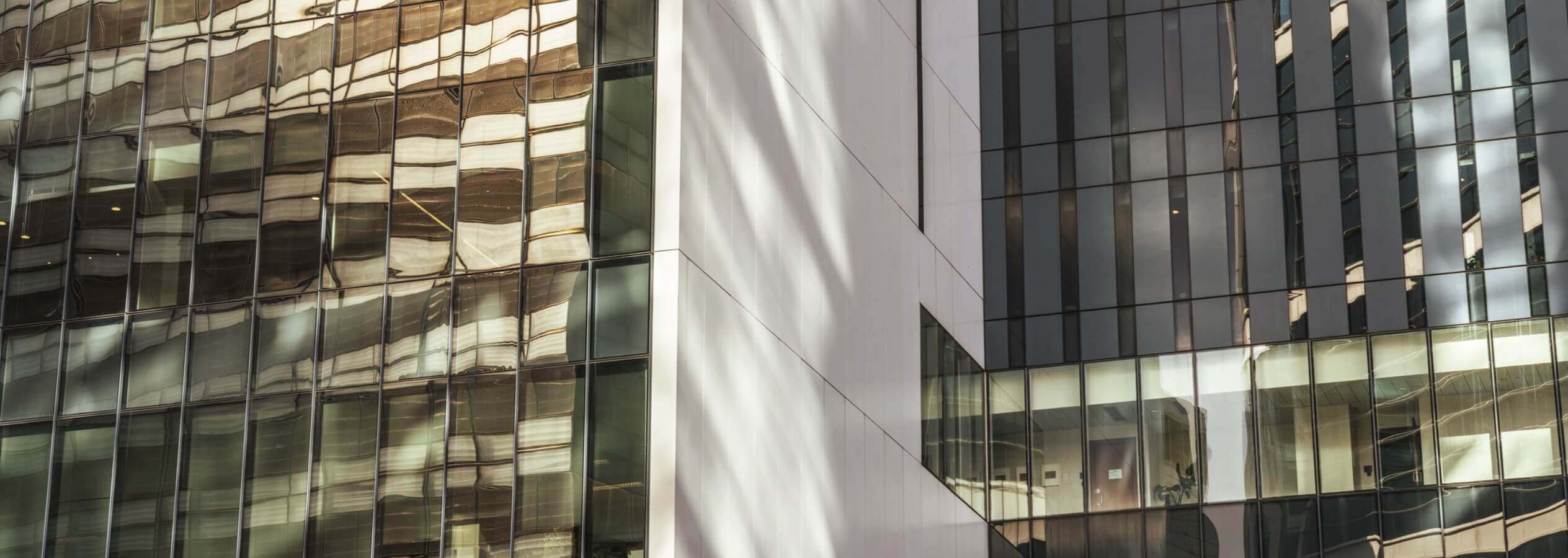 close up of glass exterior of office building