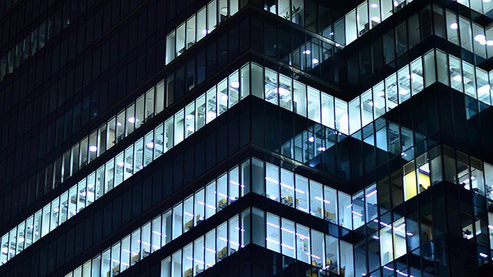 Financial building windows at night.