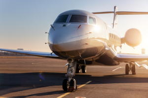 Front view of private jet on runway.