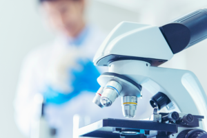 Closeup of microscope in laboratory setting