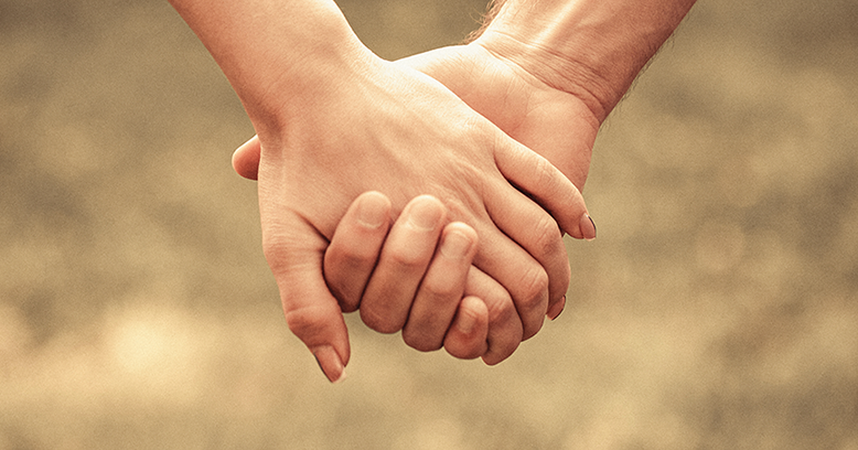 Couple holding hands